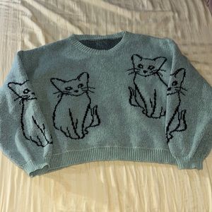 Medium green sweater with white cats
